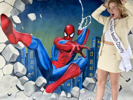 Spider-Man bursting through a wall in 3D chalk art