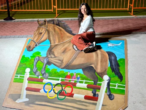 Posing with 3D painted art of jumping horse for Wellington's 30th Anniversary Celebration.